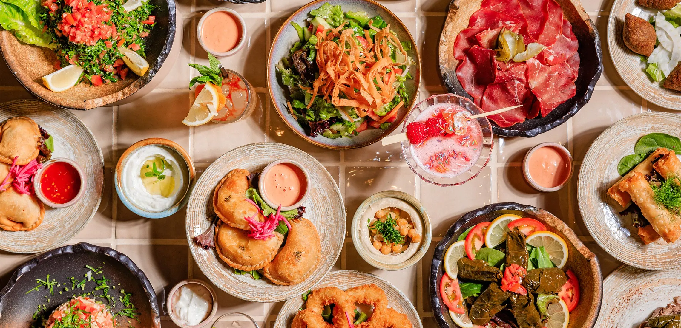Header - a table full of colourful Lebanese food